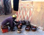 Woman painting pots